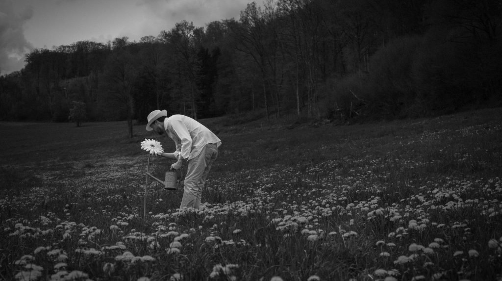 Man with Hat - Field of flowers